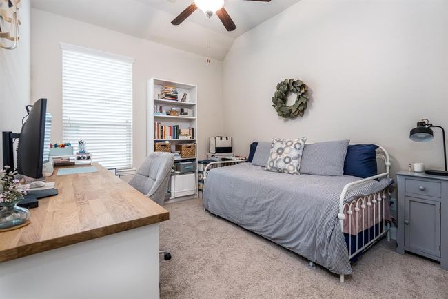 Another secondary bedroom, currently being used as a guest room as well as another office space. | Image 12