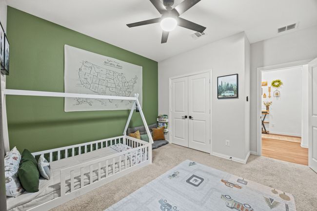 Carpeted bedroom with a closet, a ceiling fan, and baseboards | Image 15