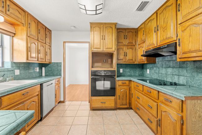 Galley Kitchen looking back into dining room | Image 9