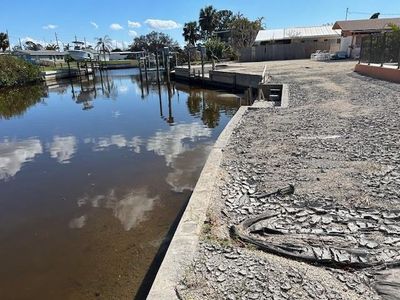 canal showing seawall. Grounds are still storm torn | Image 3