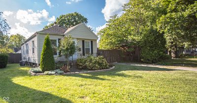 Charming 3-bedroom home with unbeatable curb appeal! Take advantage of the spacious, beautifully landscaped yard - perfect for gardening or outdoor fun. Situated in a friendly neighborhood, close to top-rated schools and lush parks. Renovation potent | Image 2