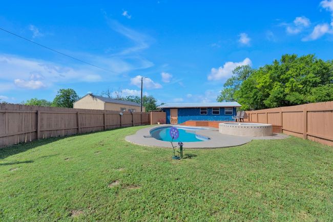 View of pool featuring a fenced backyard | Image 30