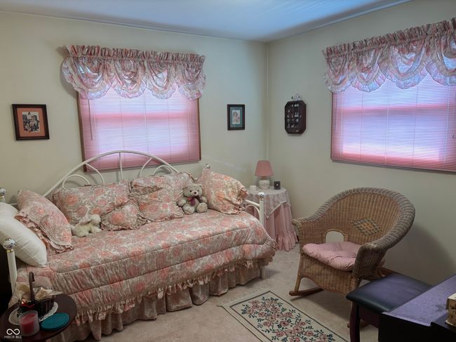 carpeted bedroom with multiple windows | Image 12