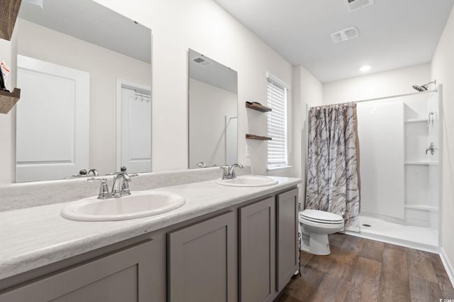 Bathroom with vanity, hardwood / wood-style floors, toilet, and walk in shower | Image 18