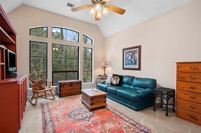 This large picture window provides a spectacular view of the property and allows natural light to illuminate this second floor living area. Plush carpeting provides a soft spot for relaxation. | Image 30