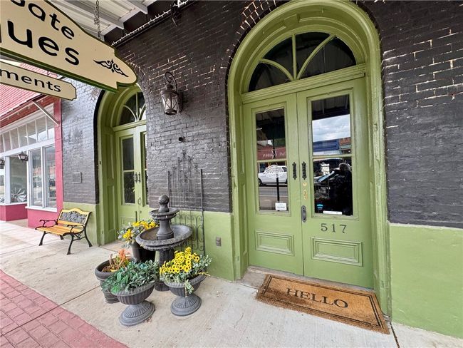 View of exterior entry featuring french doors and brick siding | Image 9