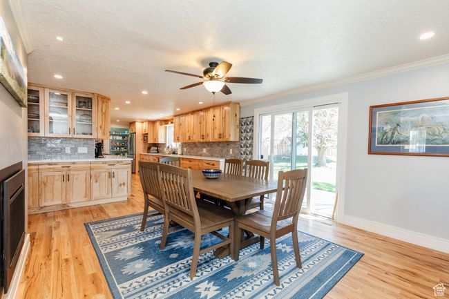 Dining space with recessed lighting, ornamental molding, and light wood-style flooring | Image 4