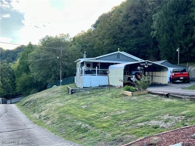 View of front facade with a front yard | Image 3