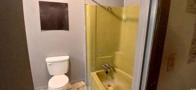 Full bathroom featuring toilet and baseboards | Image 26