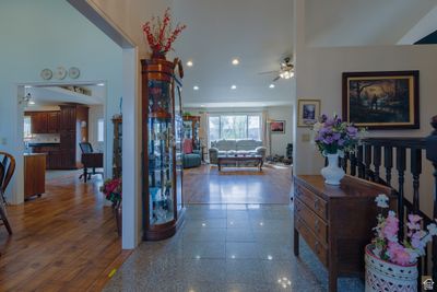 Hall featuring hardwood / wood-style flooring and a high ceiling | Image 3