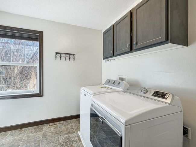 Upper level laundry has cabinets and space for laundry sink and additional storage / sorting area. | Image 28