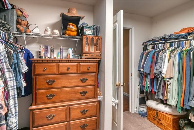 Walk in closet featuring light carpet | Image 24