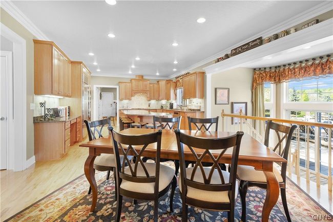 Formal living room with french doors leading to the family room. | Image 14