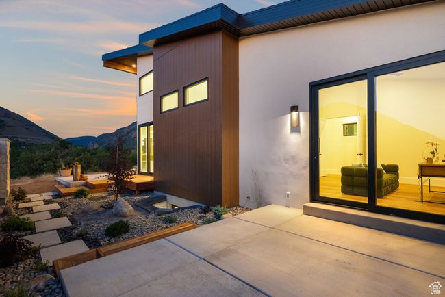 Zen Garden from the study...Property exterior at dusk with a patio area and a mountain view | Image 86