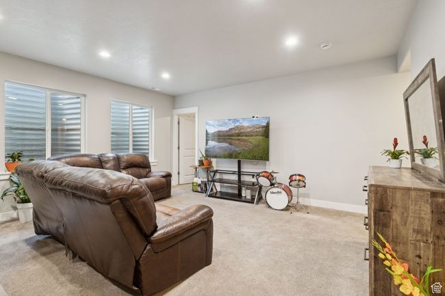 Living area featuring light colored carpet and recessed lighting | Image 32
