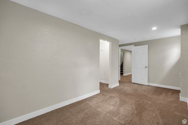 Unfurnished room featuring carpet flooring, baseboards, and recessed lighting | Image 26