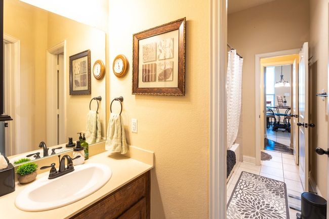 Bathroom with vanity and tile patterned floors | Image 18