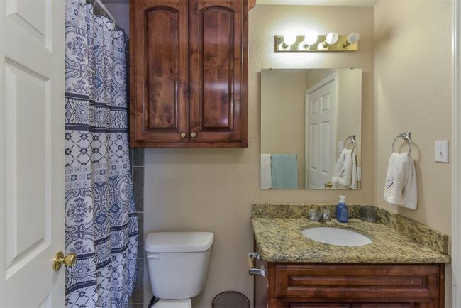 Bathroom featuring toilet and vanity | Image 14