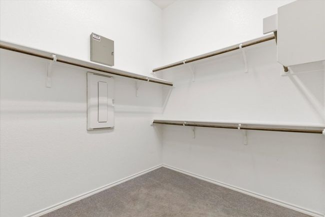 Spacious closet featuring light carpet | Image 14