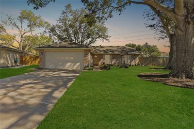 Welcome to 2302 Grindstone Lane! This home offers 1, 518 sqft of living space, and boasts 3 bedrooms, 2 bathrooms, and a large backyard. | Image 1