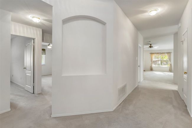 Hall with carpet and baseboards | Image 26