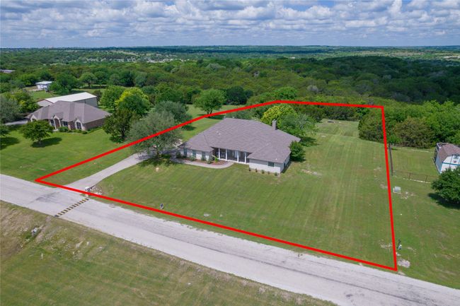 View from above of property featuring property parcel outlined and a heavily wooded area | Image 37