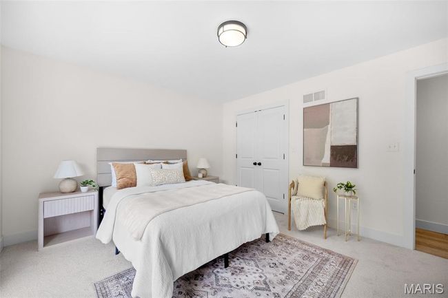 Bedroom with carpet and a closet | Image 25