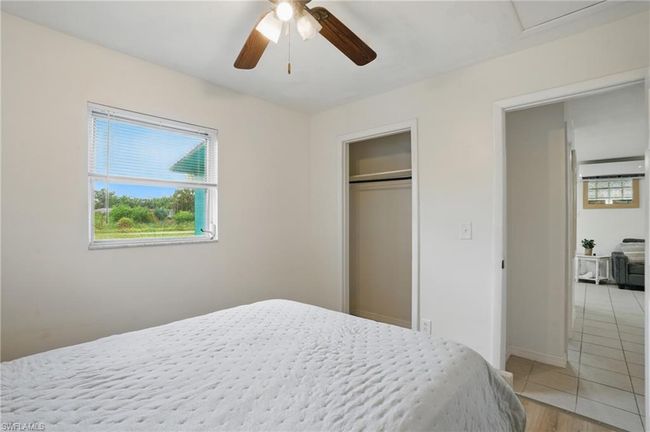 Bedroom featuring ceiling fan, a closet, and light tile patterned floors | Image 24
