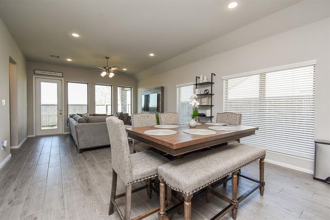 Upgraded wood tile throughout home everywhere except bedrooms and bathrooms | Image 15