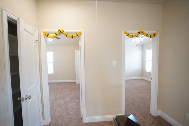 Hall featuring carpet flooring and plenty of natural light | Image 23