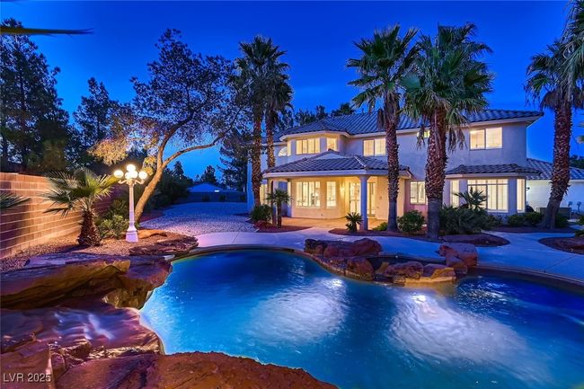 View of swimming pool with fence and a fenced in pool | Image 9