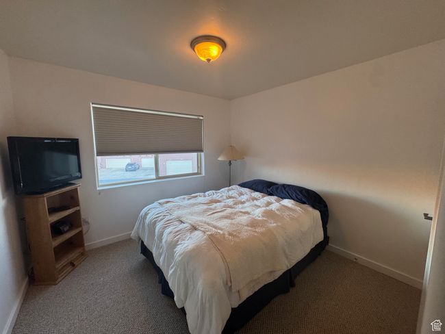 Carpeted bedroom with queen bed. mtn views | Image 12