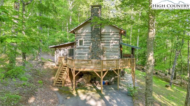 An additional wooded lot behind the cabin offers either a natural sanctuary or the perfect footprint for a future guest cottage. | Image 29