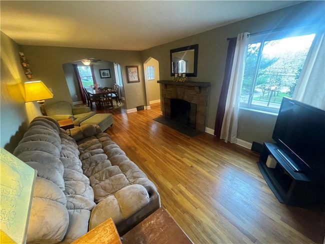 LR w/ stone wood fireplace & large window | Image 14
