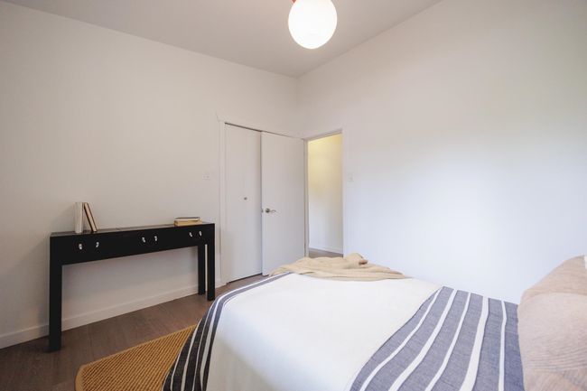 Bedroom featuring wood finished floors and a closet | Image 20