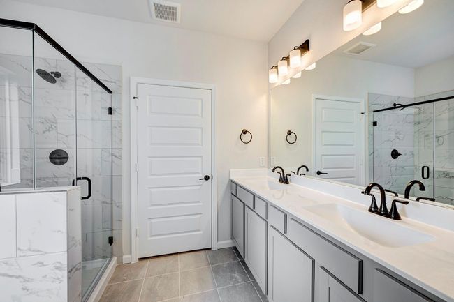 The Davenport II- Primary Bath with Dual Sinks and Walk-in Shower. Home under construction. Sample floor plan photo used for illustrative purposes only. Upgrades, selections options, windows and colors may vary. | Image 9