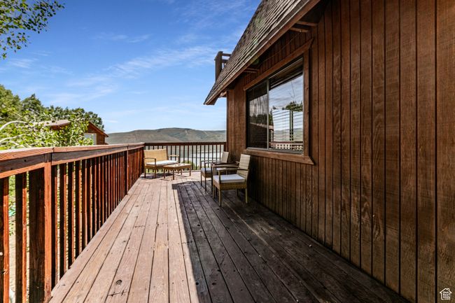 Wooden deck featuring a mountain view | Image 24