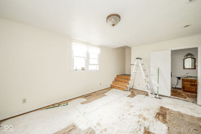 Half Bathroom located at end of family room. Back Stairway to bathroom/laundry | Image 10
