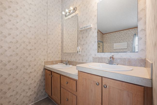 Bathroom with double vanity and crown molding | Image 21