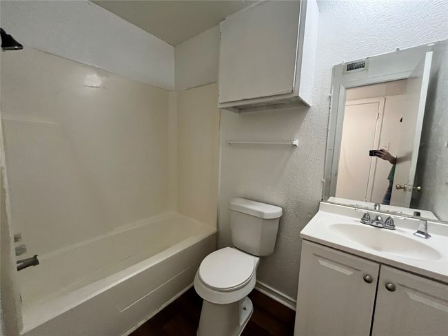 This is a view of the bathroom. Notice the shower/tub combo. | Image 12