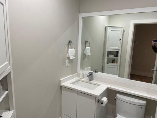 Bathroom featuring vanity and toilet | Image 14