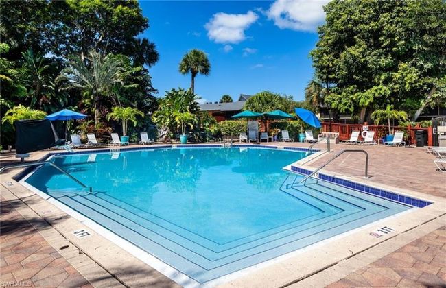 Community pool featuring a patio and fence | Image 30