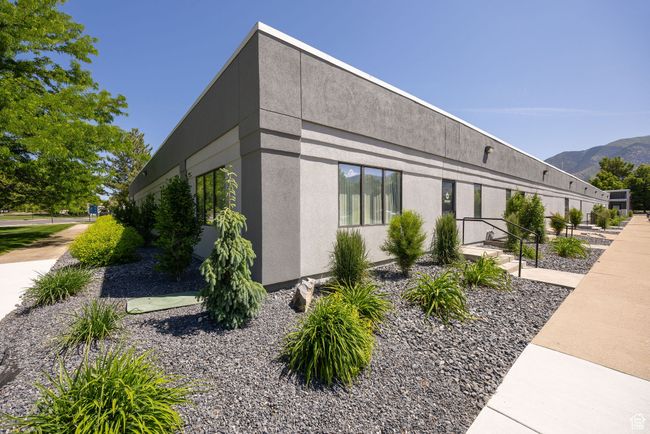 View of property exterior featuring stucco siding and a mountain view | Image 26