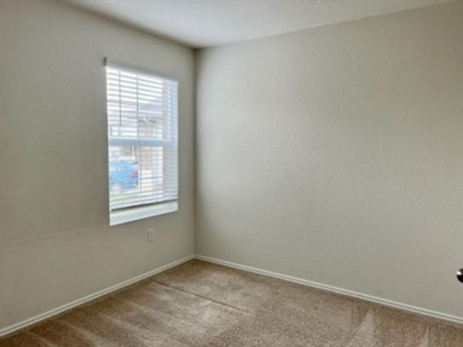 Carpeted empty room with healthy amount of natural light | Image 12