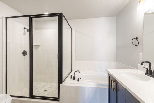Bathroom with a bath, vanity, and a shower stall | Image 18