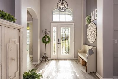 Foyer that leads into living room & dining area. | Image 2