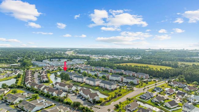 Aerial view of property's location featuring nearby suburban area and a large body of water | Image 30