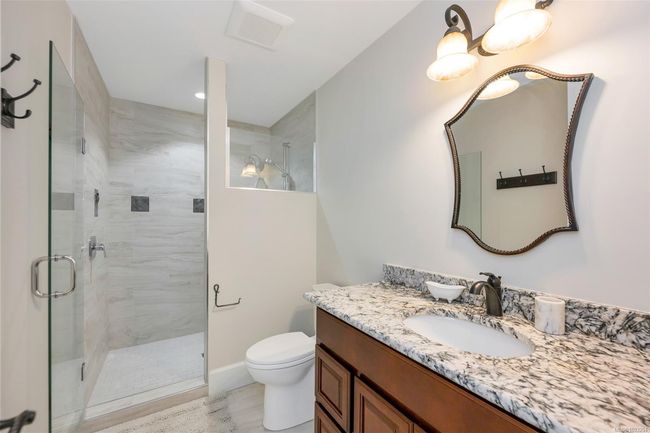 Full bath featuring vanity, a shower stall, and recessed lighting | Image 61