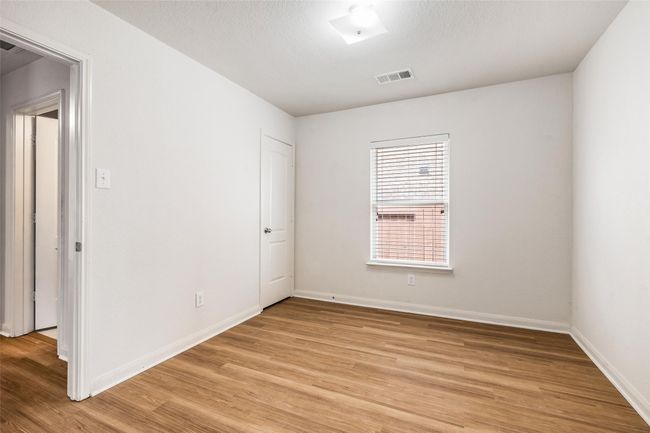 Unfurnished room featuring light wood-style flooring and baseboards | Image 15