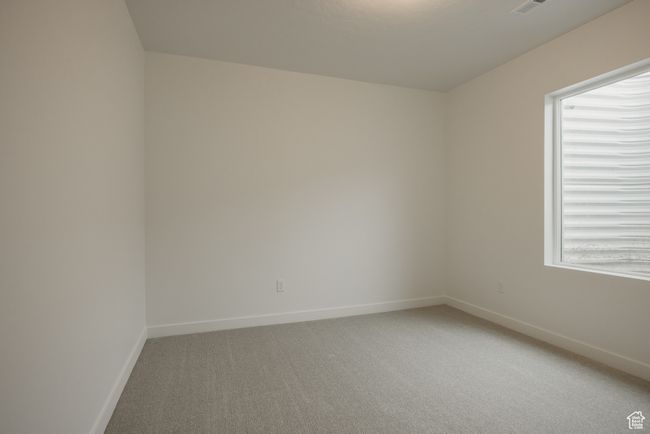 Unfurnished room with light colored carpet and baseboards | Image 40